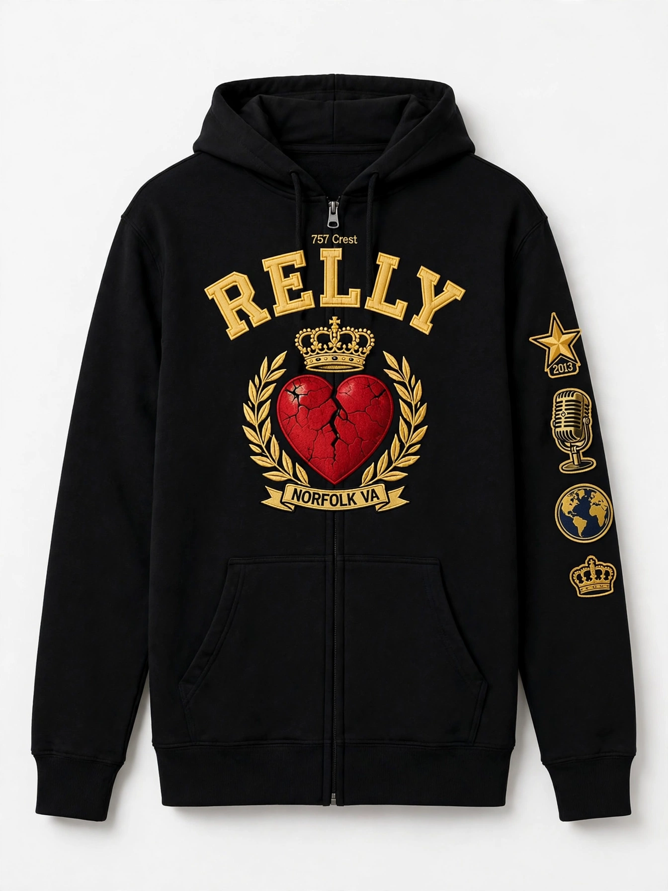 757 Crest hoodie — black collegiate zip hoodie with RELLY in gold varsity arch over a crest of gold crown and cracked red heart with laurel branches and a NORFOLK VA banner, badge patches down the sleeve